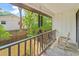Relaxing covered porch with rocking chair overlooking fenced backyard at 315 73Rd Ave. N # 2, Myrtle Beach, SC 29572