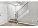 Carpeted staircase leading up to the second floor with rail and white accents at 315 73Rd Ave. N # 2, Myrtle Beach, SC 29572