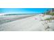 Wide sandy beach with ocean views and sparse vegetation along the dunes at 3308 S Ocean Blvd. # 2_B, North Myrtle Beach, SC 29582