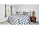 Cozy bedroom with a classic bed frame, complemented by warm lighting and a window view at 3308 S Ocean Blvd. # 2_B, North Myrtle Beach, SC 29582