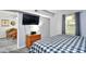 Bright bedroom featuring a TV, a small chest of drawers, and a view into an adjacent room at 3308 S Ocean Blvd. # 2_B, North Myrtle Beach, SC 29582