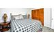 Bedroom with a queen bed, decorative lamps and pillows and a large closet at 3308 S Ocean Blvd. # 2_B, North Myrtle Beach, SC 29582