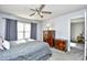 Well-lit bedroom with a plush bed, complemented by wooden dresser and nightstand at 3308 S Ocean Blvd. # 2_B, North Myrtle Beach, SC 29582