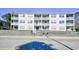 Low-rise condo building with multiple balconies and a view of the street at 3308 S Ocean Blvd. # 2_B, North Myrtle Beach, SC 29582