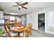 Cozy dining area features wood table and chairs adjacent to the kitchen and open to the bedroom at 3308 S Ocean Blvd. # 2_B, North Myrtle Beach, SC 29582