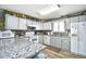 Kitchen with white appliances, ample cabinetry, and a granite countertop at 3308 S Ocean Blvd. # 2_B, North Myrtle Beach, SC 29582