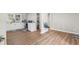 Living space with hardwood floors, leading to a kitchen with white cabinets and a bathroom at 3519 Cates Bay Hwy., Conway, SC 29527