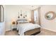 Bright bedroom with neutral decor, bedside lamps, and decorative wall hangings for a warm, inviting atmosphere at 3562 Ashridge Way, Conway, SC 29526