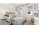 Inviting bedroom with patterned wallpaper, a cozy bed, and large windows at 3562 Ashridge Way, Conway, SC 29526