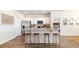 Kitchen with white cabinetry, stainless appliances, granite countertops, and an island with bar stool seating at 3562 Ashridge Way, Conway, SC 29526