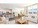 Bright living room with modern decor, an open floorplan, and large windows at 3562 Ashridge Way, Conway, SC 29526