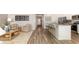 Open-concept living space showcasing kitchen island, seating area and natural light throughout the home at 3562 Ashridge Way, Conway, SC 29526