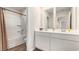 Clean and bright bathroom with double vanity, shower, and stylish fixtures at 3579 Ashridge Way, Conway, SC 29526