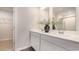 Bathroom with double sink vanity, framed mirrors and access to the walk-in closet at 3579 Ashridge Way, Conway, SC 29526