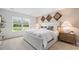 Calm bedroom showcasing a large window, neutral tones, and scenic views at 3579 Ashridge Way, Conway, SC 29526