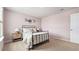 Cozy bedroom with plush bedding, pale pink walls, and whimsical animal decorations at 3579 Ashridge Way, Conway, SC 29526