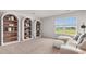Cozy bonus room with built-in bookcases, comfortable seating and natural light at 3579 Ashridge Way, Conway, SC 29526