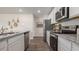 Modern kitchen featuring stainless steel appliances, granite counters and white cabinets at 3579 Ashridge Way, Conway, SC 29526