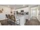 Modern kitchen with granite countertops, stainless steel appliances, and a breakfast bar at 3579 Ashridge Way, Conway, SC 29526