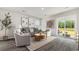 Bright and airy living room with stylish furniture, decor, and a sliding glass door to the backyard at 3579 Ashridge Way, Conway, SC 29526