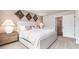 Neutral bedroom with modern decor, large bed and carpeted floors at 3579 Ashridge Way, Conway, SC 29526