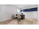 Functional home office with modern desk and seating, featuring a window and door at 3579 Ashridge Way, Conway, SC 29526