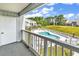 Balcony with a view of the community pool, perfect for relaxation and enjoying sunny days at 3700 Golf Colony Lane # 25G, Little River, SC 29566