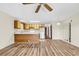 Spacious living area with wood floors flowing into the kitchen, great for entertaining guests at 3700 Golf Colony Lane # 25G, Little River, SC 29566