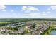 Aerial view of real estate showcasing waterfront condos, lush landscaping, and beautiful surroundings at 3983 Forsythia Ct. # 301, Myrtle Beach, SC 29588