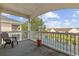 Relaxing balcony view with a chair, a flower pot, and a lovely overlook of the pond at 3983 Forsythia Ct. # 301, Myrtle Beach, SC 29588