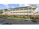 A well-maintained three-story condo with brick base, charming balconies, and accessible parking in a well-landscaped community at 3983 Forsythia Ct. # 301, Myrtle Beach, SC 29588