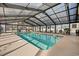 Bright indoor pool area with large windows, perfect for swimming and relaxation year-round at 3983 Forsythia Ct. # 301, Myrtle Beach, SC 29588