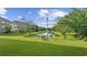 Scenic view of a well-maintained pond and green space surrounding the apartments, creating a peaceful environment at 3983 Forsythia Ct. # 301, Myrtle Beach, SC 29588