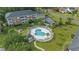 Aerial view of community pool, surrounding buildings, and lush landscaping at 3983 Forsythia Ct. # 301, Myrtle Beach, SC 29588