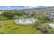 Community pool and landscaped area with palm trees and lounge chairs at 3983 Forsythia Ct. # 301, Myrtle Beach, SC 29588