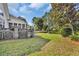 Spacious backyard with a manicured lawn, fountain, and outdoor kitchen at 4232 Pointer Ct., Myrtle Beach, SC 29579