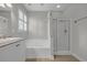 Bright bathroom with a soaking tub, separate shower, and large window with plantation shutters at 4232 Pointer Ct., Myrtle Beach, SC 29579