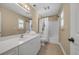 Bright bathroom featuring a white vanity, tile flooring, and a shower-tub combination at 4232 Pointer Ct., Myrtle Beach, SC 29579