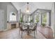 Dining room with large windows, arched details, and a glass table with seating for four at 4232 Pointer Ct., Myrtle Beach, SC 29579