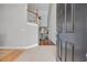 Spacious foyer with tile flooring, staircase, and entry to the living room featuring hardwood floors at 4232 Pointer Ct., Myrtle Beach, SC 29579