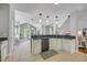 Kitchen boasts stainless appliances, granite counters, pendant lights, and seamless flow to living spaces at 4232 Pointer Ct., Myrtle Beach, SC 29579