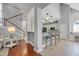 Open-concept kitchen with bar seating, pendant lighting, and views of the staircase at 4232 Pointer Ct., Myrtle Beach, SC 29579