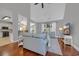 Open-concept living room featuring hardwood floors, vaulted ceilings, and an abundance of natural light at 4232 Pointer Ct., Myrtle Beach, SC 29579