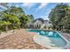 Beautiful backyard with an in-ground pool, large deck, and lush landscaping at 4232 Pointer Ct., Myrtle Beach, SC 29579