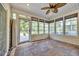 Cozy sunroom with natural light, tile floors, and access to the backyard at 4232 Pointer Ct., Myrtle Beach, SC 29579