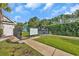 Gated tennis court with a privacy fence and landscaping at 4232 Pointer Ct., Myrtle Beach, SC 29579
