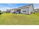 This backyard features a grill and outdoor seating, perfect for relaxing and entertaining at 446 Rycola Circle, Surfside Beach, SC 29575
