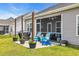 Outdoor space features a screened porch with seating and a grill, perfect for entertaining at 446 Rycola Circle, Surfside Beach, SC 29575
