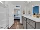 En-suite bathroom featuring a white vanity, shower, and view into the primary bedroom at 446 Rycola Circle, Surfside Beach, SC 29575