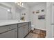 Well-lit bathroom features gray cabinets, white quartz countertops, and a shower-tub combination at 446 Rycola Circle, Surfside Beach, SC 29575
